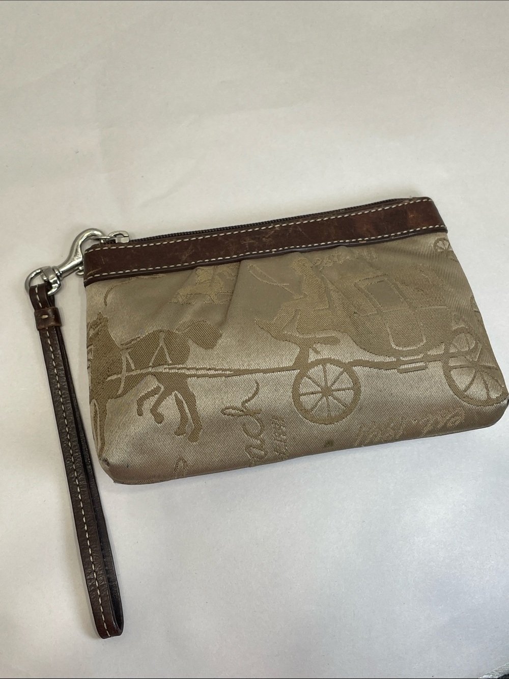 Coach Canvas Horse & Carriage Wristlet in Taupe with Brown Trim. Preowned. Spots